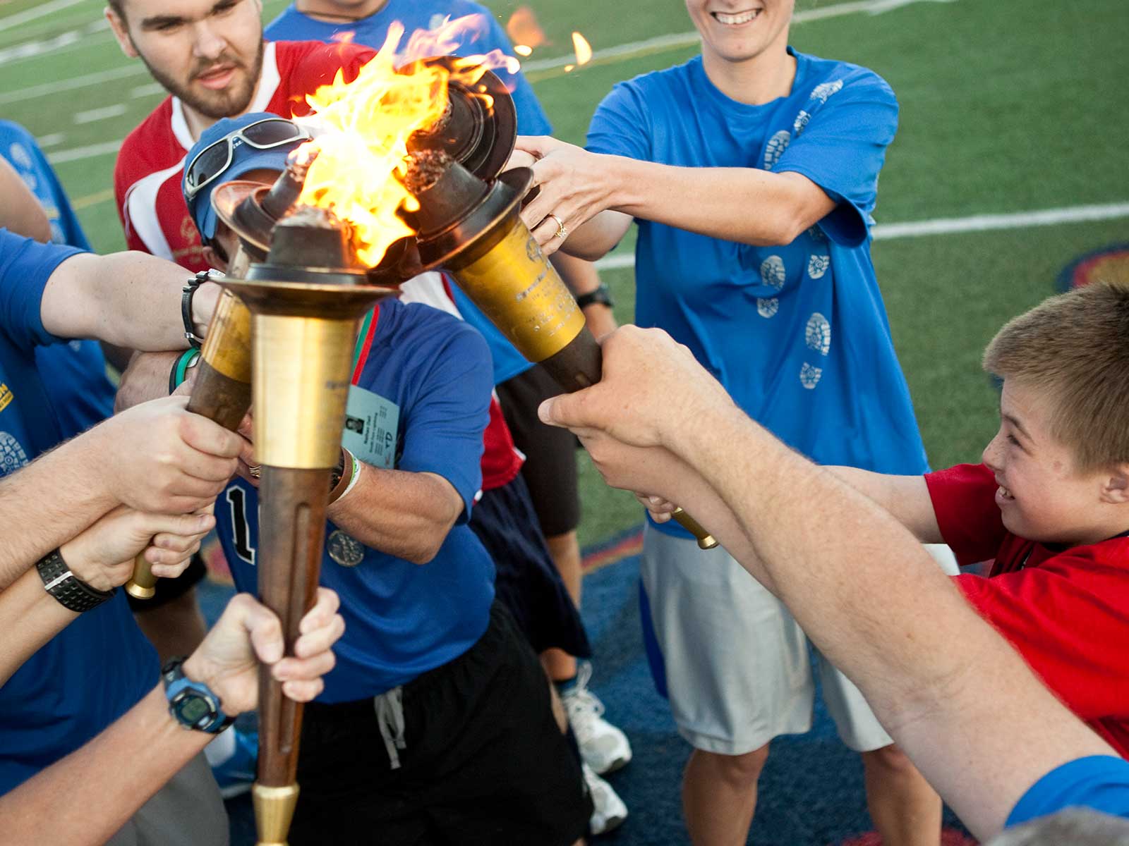 Athletes torches together